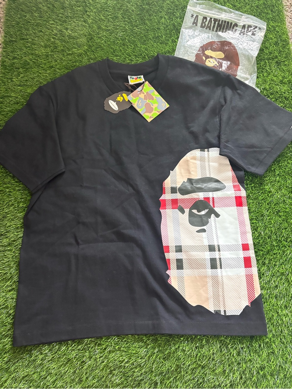 A Bathing Ape Black Short Sleeve Tee with Plaid Ape Head Graphic